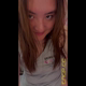 Emi squats on the toilet seat with her ass to the camera for a mucusy pre-period shit, shows the bowl, then smiles and fans the smell for the camera. Vertical format video. Over 5 minutes.
